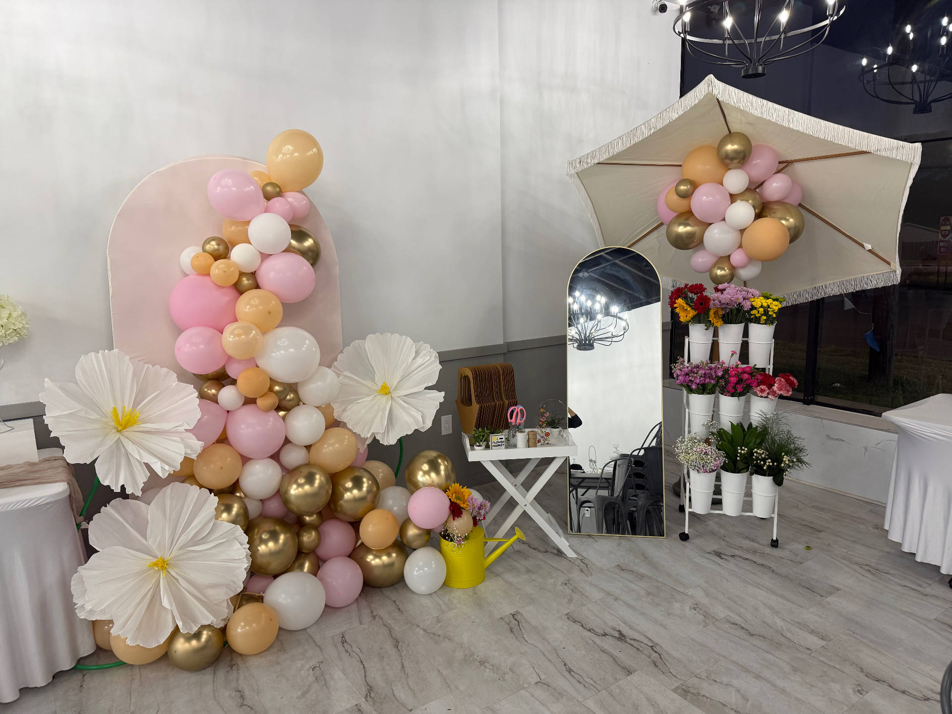 Blush and gold balloon garland with a fresh flower bar and oversized white blooms by Pretty Little Parties